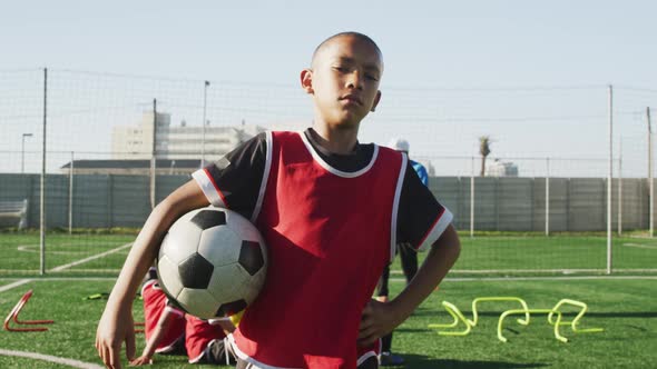 African American soccer kid exercising in a sunny day