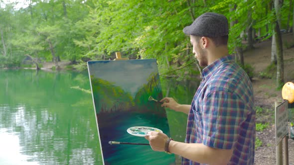 Drawing a nature on the canvas.