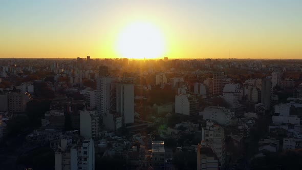 Drone: Sunset over the CIty. Forward movement. Slow.