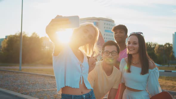 Young Multiethnic Hipster Friends on Summer Holidays Make Selfie Using Smartphone at Beach