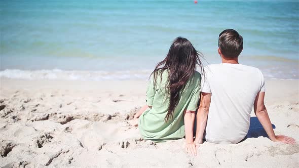 Young Couple on White Beach During Summer Vacation.