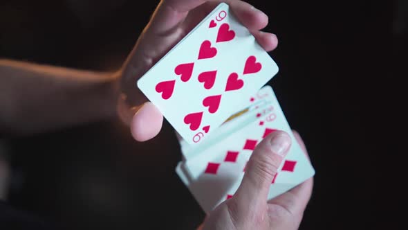 Close-up. Slow motion. Men's hands mix a deck of cards. Gambling Top view