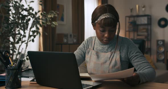 A Young Girl Takes a Break From Work to Write Back Overdue Messages