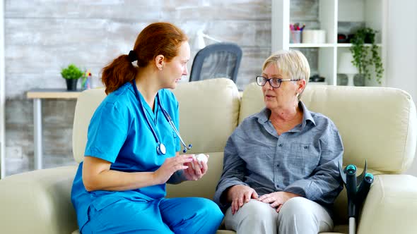 Female Doctor Consultin a Senior Woman About Pills Dosage and Subscription alt
