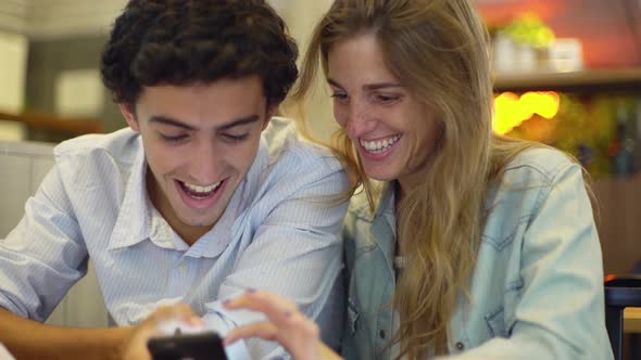 Couple using smartphone together