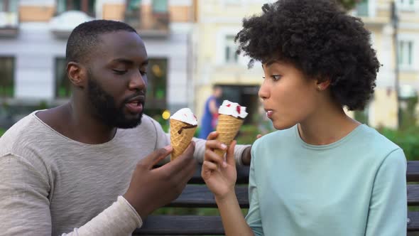 Love Partners Sharing Ice-Cream During Summer Date in City Park, Fun Together