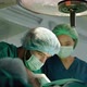Doctors and nurses in the operating room are helping to perform life-saving surgery in the hospital. - VideoHive Item for Sale