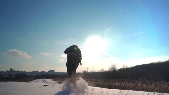 Happy Guy Runs in Snow and Does Somersaults