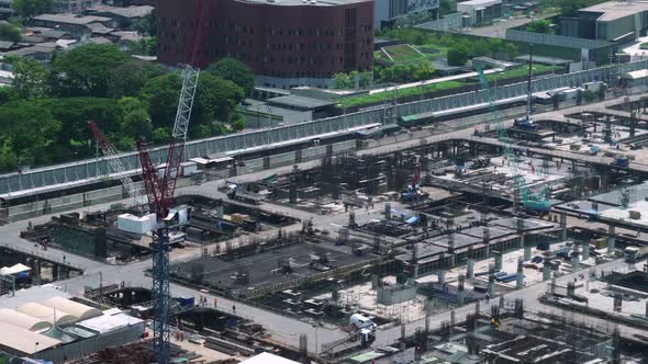 Large Construction Site with Heavy Construction Machinery in Metropolis