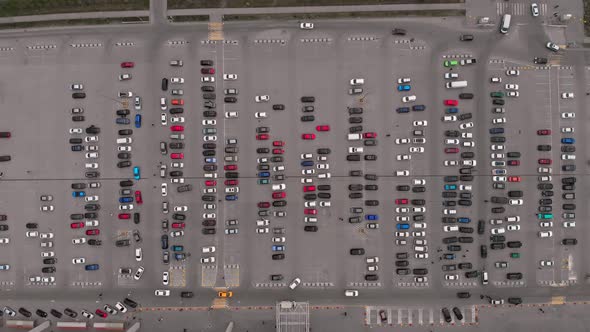 The Drone Flies Over a Large Parking Lot Where a Large Number of Cars are Parked