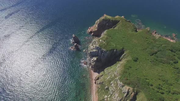 View From a Drone of the Coastline with a Rocky Coast Island of Shkot