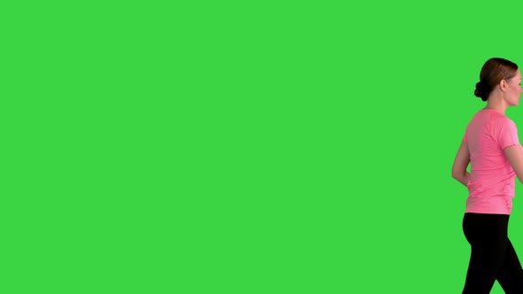 Attractive Sporty Woman Walking By on a Green Screen Chroma Key