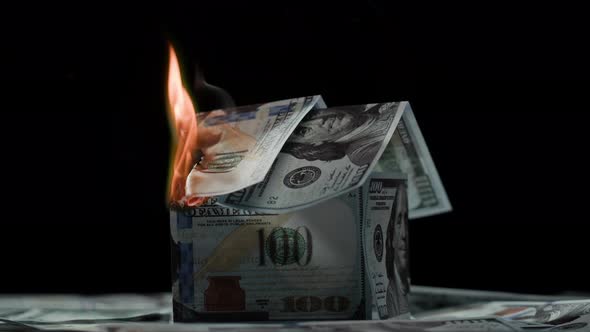 Burning of American 100 Dollar Banknotes on Black Background