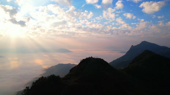 4K Aerial video, The sun's rays over mist in the morning