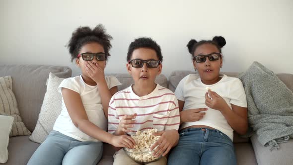 Cute Children in 3d Glasses Watching Movie on Couch