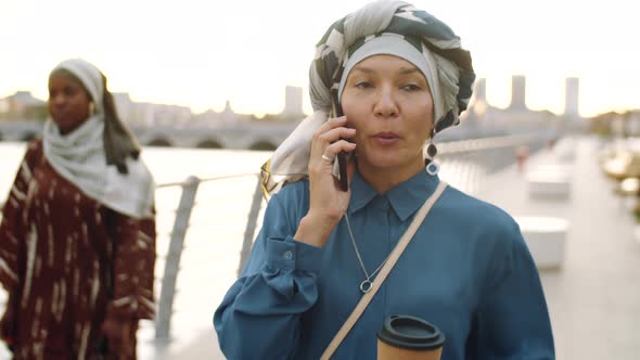 Mature Woman Talking on Phone on Walk