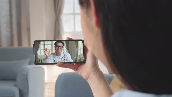 Woman Video Call With Doctor On Mobile Phone