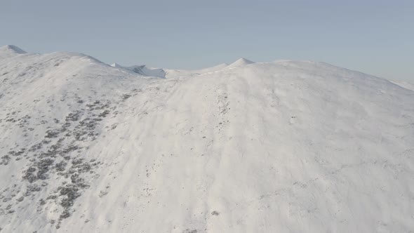 snow-white snow lies at the top of the hill