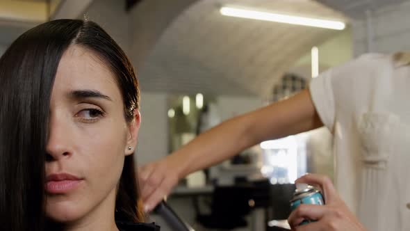 Hairdresser styling customer hair