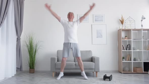 Home Fitness Middleaged Man Jumping Jack Exercise