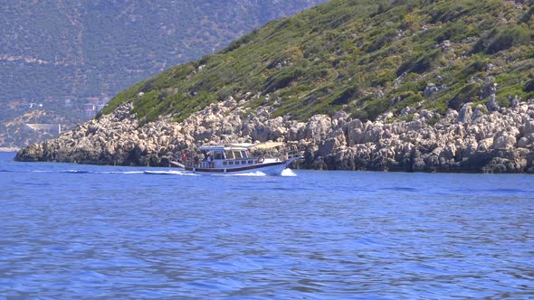 Sightseeing Boat Sailing Side Rocky Islands In The Sea