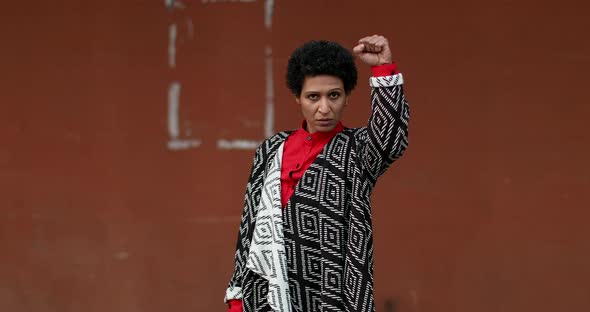 Portrait of woman rising fist, Pistoia, Tuscany, Italy