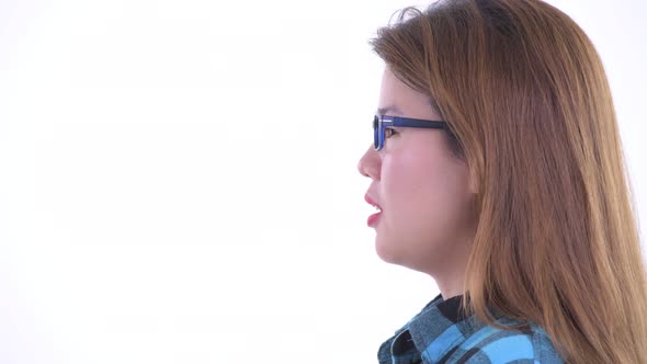 Closeup Profile View of Happy Young Asian Hipster Woman Talking