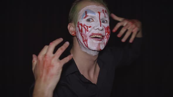 Clown Halloween Man Portrait. Creepy, Evil Clowns Blood Face. White Face Makeup
