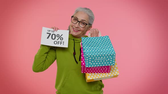 Senior Granny Woman Showing Shopping Bags and Up To 70 Percent Off Inscriptions Banner Black Friday