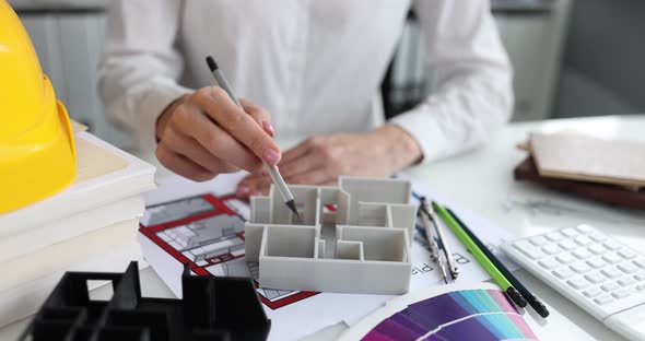 Designer Architect Shows Project Layout of Housing Closeup