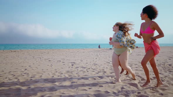 multiethnic young women having fun on the beach