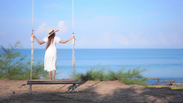 Asian woman enjoy around beautiful beach sea ocean