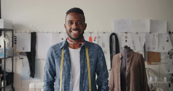 Portrait of Creative Young Tailor African American Man Smiling in Studio