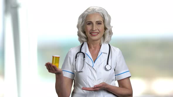 Female Doctor Presenting New Pills.