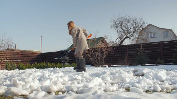 Clearing Snow In The Backyard