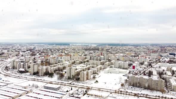 Residential block monolith building district of Kaunas during heavy snowfall, aerial view