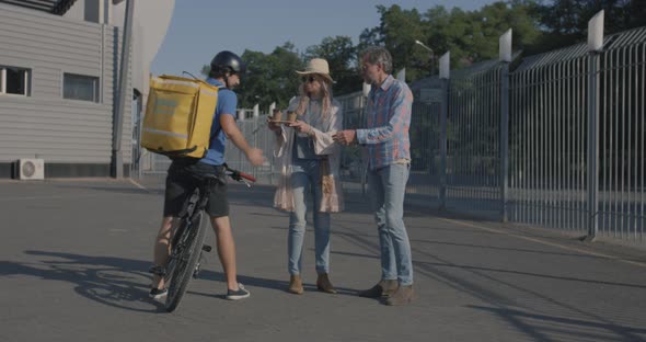 Bicycle Messenger Delivers Food To Couple