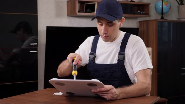 A Male Handyman Repairs Floor Scales in a Client's Home