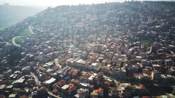 Drone view on poverty slum district and muslim mosque