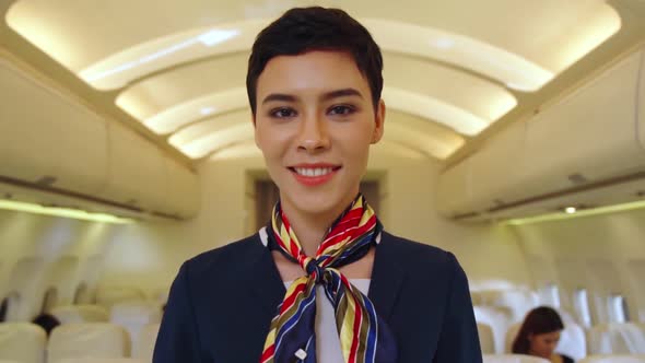 Cabin Crew or Air Hostess Working in Airplane