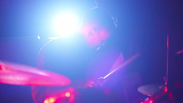 Drummer Playing Drums in the Nightclub