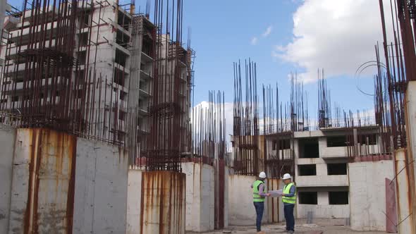 Engineers Working on Building Site