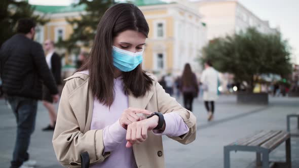 Young Tourist Woman Looking on Smart Watch Near Airport