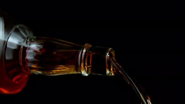 Super Slow Motion Shot of Pouring Whiskey From Bottle at 1000Fps with Camera Movement