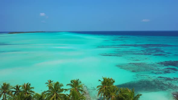 Beautiful drone copy space shot of a sunshine white sandy paradise beach and turquoise sea backgroun