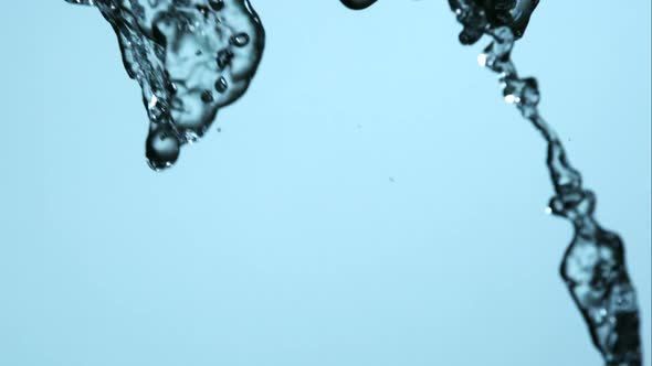 Water pouring and splashing in ultra slow motion 