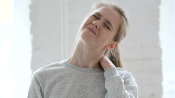 Tired Young Woman Trying to Relax Body By Stretching