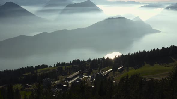 aerial view over amazing mountain landscape with fog covered mountains and lake. rigi switzerland