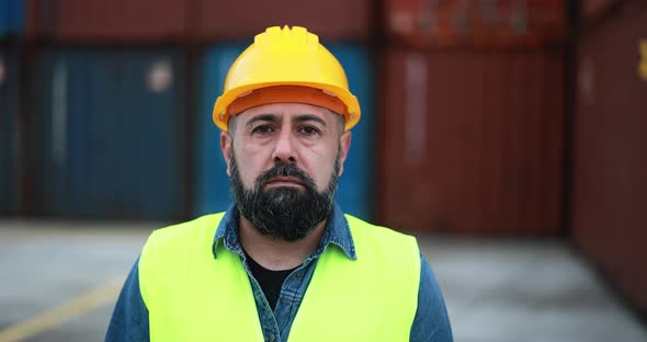 Man looking on camera working at freight terminal port