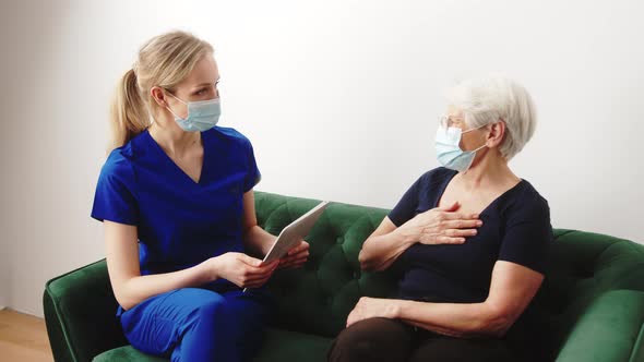 An Elderly Woman Patient Receiving Her Diagnosis From a Doctor After a Medical Checkup in a Hospital